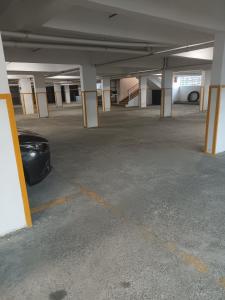 an empty parking garage with a car parked in it at 1 bedroom BNB Meru in Meru