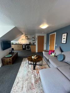 Χώρος καθιστικού στο Caledonian House Apartment