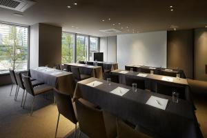 a conference room with tables and chairs and a television at Shilla Stay Mapo Hongdae in Seoul