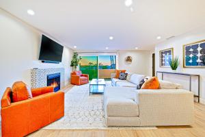 a living room with two couches and a fireplace at Calafia Beach Condo 257 #1 in San Clemente