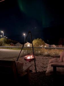 a hammock in the middle of a street at night at Arctic City Suites 1 in Kirkenes