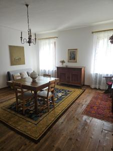 a living room with a table and a couch at La casa di Mel in Mel