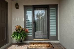 a welcome mat in front of a door with a welcome sign at 1905 Bohicket Marina in Seabrook Island