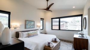 a bedroom with a large bed and a window at Hilltop Chateau in Steamboat Springs