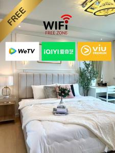 a bedroom with a large white bed in a room at icondo มิตรภาพซอย4 in Nakhon Ratchasima