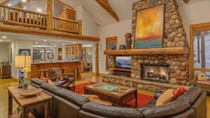 a living room with a couch and a fireplace at Inglenook in Breckenridge