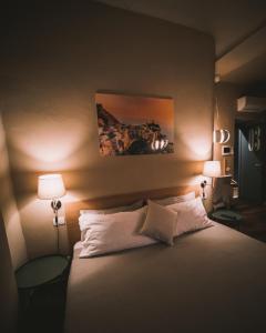 Ένα ή περισσότερα κρεβάτια σε δωμάτιο στο holidays rooms Fazio
