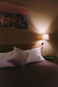 Ένα ή περισσότερα κρεβάτια σε δωμάτιο στο holidays rooms Fazio