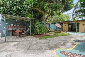 a house with a table and chairs in a yard at Room C – Perfect Rest in Heredia in San Juan Arriba