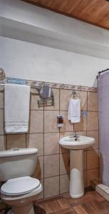 a bathroom with a toilet and a sink at Room C – Perfect Rest in Heredia in San Juan Arriba