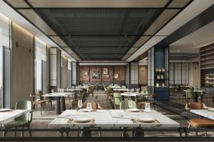 Una representación de un restaurante con mesas y sillas. en Four Points by Sheraton Yantai Zhifu, en Yantai 10 fotos más