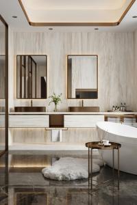 a bathroom with a tub and a sink at JW Marriott Hotel Tashkent in Tashkent
