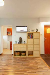 a living room with a tv on a wall at City Vibes Warsaw Sienna by P&M in Warsaw