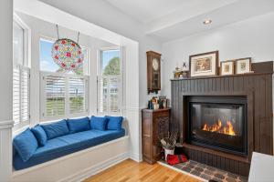 a living room with a blue couch and a fireplace at Château Saint-Émile in Namur +46 photos