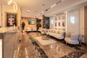 a large living room with a couch and a table at Pyramids sunrise inn in Cairo