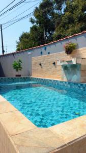 Swimmingpoolen hos eller tæt på Casa com piscina climatizada em Itanhaém!