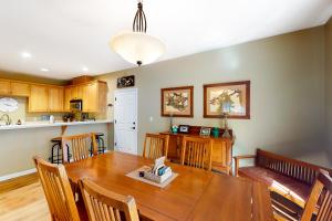 a kitchen and dining room with a wooden table at Northshore Lakeview Getaway in Bass Lake