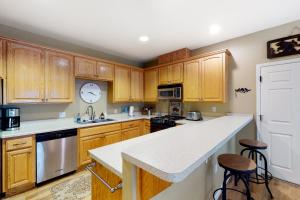 a kitchen with wooden cabinets and a counter top at Northshore Lakeview Getaway in Bass Lake
