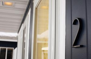 a glass door with a handle on a house at Maple Grove Lodging in Finland +8 photos