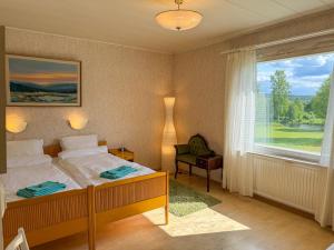 Postel nebo postele na pokoji v ubytování Villa Tuomaa - Authentic Riverside Residence