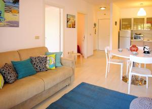 a living room with a couch and a table at Apartment Pine Wood in Bibione +114 photos