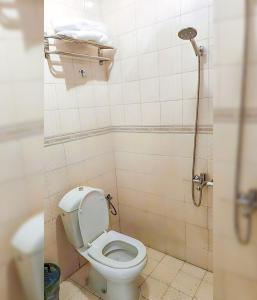 a bathroom with a toilet and a shower at جراند خيال للشقق المخدومة in Abha +40 photos