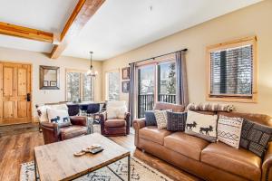 a living room with a couch and a table at Take A Break In Breck in Breckenridge
