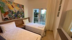 Ένα ή περισσότερα κρεβάτια σε δωμάτιο στο Kemer Comfort Apartment 02