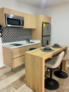 Η κουζίνα ή μικρή κουζίνα στο Estudio moderno con alberca - Centro