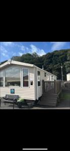 a mobile home with a porch and a deck at 20 Chestnut Grove in Stranraer