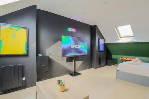 Ένα ή περισσότερα κρεβάτια σε δωμάτιο στο Immersion Foot - PS5 - Près du Stade Bollaert