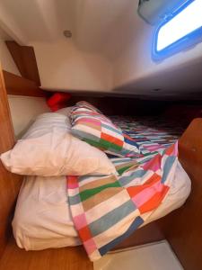 a bed in the middle of a boat at DeepBlue sail boat in Lisbon