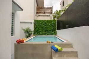 a small swimming pool with toys in a backyard at Portocafe Ocean Park Home 5Bd 4b Pool WalkToBeach in San Juan