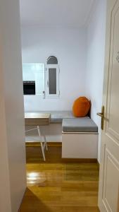 a small room with a desk and a bed at Neoclassical apartment in kadmia in Thiva