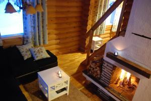 Posezení v ubytování Revontuli Resort Cottages + 116 fotografií