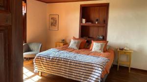 En eller flere senge i et værelse på Casa Antonio Taño