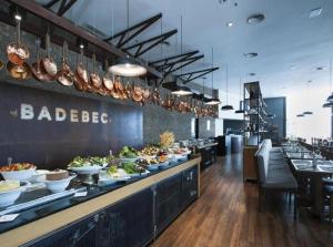 a buffet line with plates of food on it at Flat Conforto Luxo Vila Olimpia in Sao Paulo