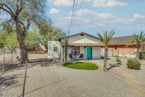 a home in the desert with a palm tree at Casita Anita - Charmer 1 Mi to Dtwn Tucson in Tucson