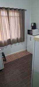 Kuchyň nebo kuchyňský kout v ubytování Quarto central em ótima localização
