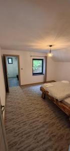 Ένα ή περισσότερα κρεβάτια σε δωμάτιο στο The Nest on the Hill