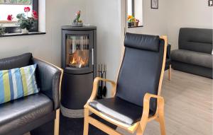 A seating area at Nice Home In Haderslev With Sauna