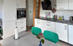 A kitchen or kitchenette at Nice Home In Haderslev With Sauna