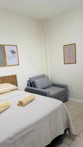 a bedroom with a bed and a couch at Studio 714 - Flamengo in Rio de Janeiro