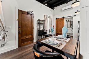 a dining room with a wooden table and chairs at The Artifact in San Diego +191 photos