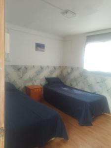 Postel nebo postele na pokoji v ubytování Pieza para 2