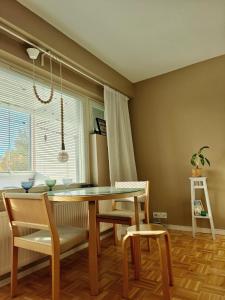 a dining room with a table and chairs at Black Elegant - Feel Lapland With Design & Style in Rovaniemi