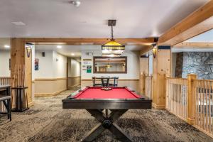 a pool table in a room with a ping pong ball at Steps to Superbee Lift with Hot Tubs & Mountain Views in Frisco +11 photos