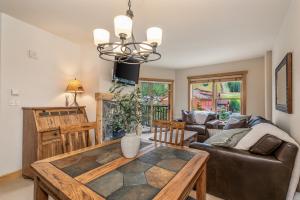a living room with a couch and a table at Small Town Feel Big Mountain Access in Frisco