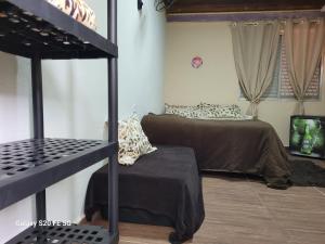 a bedroom with two beds in a room at Pousada do Sossego Mar e verde 3 in Itanhaém +106 photos