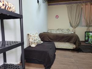 two beds in a room with a bunk bed at Pousada do Sossego Mar e verde 3 in Itanhaém +117 photos